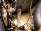a close up of a motorcycle with a chain attached to it