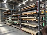 many shelves of wood in a warehouse with a lot of them