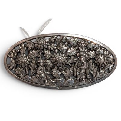an image of a silver plate with flowers on it on a white surface