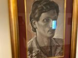 framed portrait of a woman with a cell phone in her hand