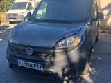 the van is parked in the parking lot next to the building