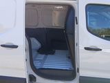 a white van with the door open and the seat down