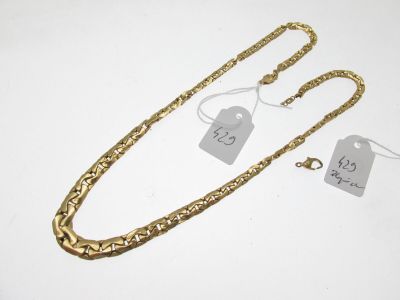 an image of a gold chain with a price tag on it