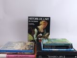 several books are stacked on top of each other on a table