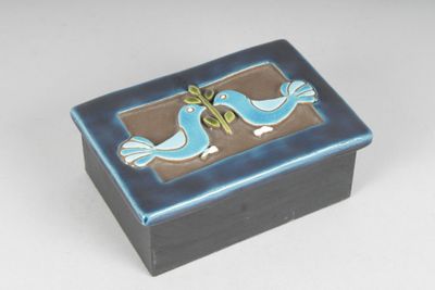 a small blue box with two birds on it
