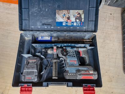 a tool box with tools in it sitting on a table