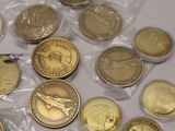 a lot of coins that are on the table