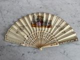 a fan that has a picture of a woman on it
