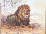 a painting of a lion laying down on the ground