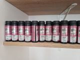a shelf with a lot of bottles on it