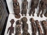 a lot of wooden figurines sitting on a table