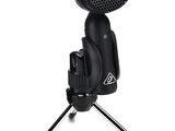 a close up of a microphone on a tripod on a white background