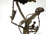 an image of a sculpture of a bird sitting on a branch