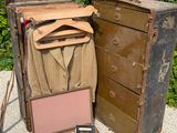 two old suitcases sitting next to each other on the ground