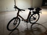 a bike parked in a garage with a basket on the back of it
