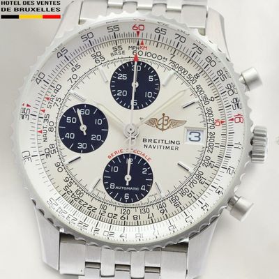 a close up of a watch on a white surface