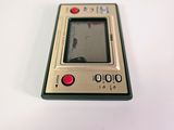 a small electronic device sitting on a white surface