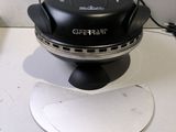 a black and silver grill on a white counter