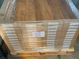 a box of wood on a pallet in a warehouse
