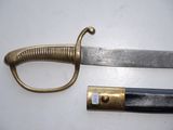a knife that is laying next to a knife on a table