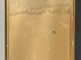 an old picture of a box with a piece of paper on top of it