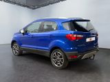the rear end of a blue ford eco - cross parked in a showroom