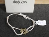a bracelet that has a gold anchor on it