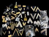many different types of military badges on a black background