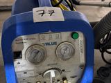 a blue and white machine that is sitting on a table