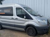 a silver van that is parked in front of a building