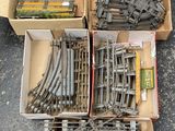 a box full of train tracks and a box of other train tracks