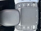 a cell phone sitting in the center of a car