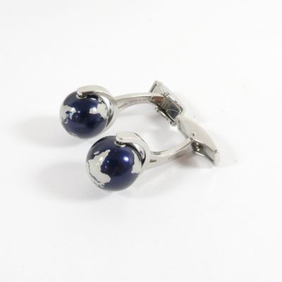 pair of cufflinks with blue glass balls on a white background