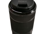the camera lens is sitting on top of a plastic cup