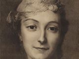 an old black and white photo of a woman with a headband