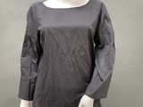 an image of a mannequin mannequin wearing a gray top