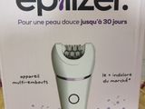 packaging for an epilizer electric shaver on a wooden surface