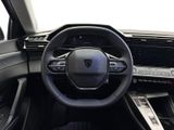 the interior of a car with a steering wheel and dashboard controls