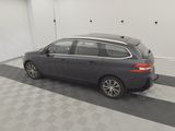 the car is parked in the garage on the checkered floor