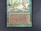 a card that has a picture of a man walking in the woods