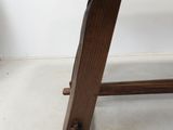 a wooden bench that is sitting in a room