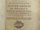 an old book that is open on a table