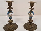 pair of antique brass candlesticks decorated with blue and white flowers