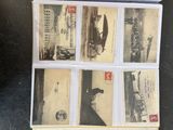 a picture of a collection of old postcards on a table