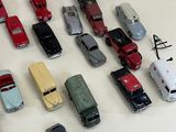 a lot of toy cars that are sitting on a table