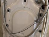 an image of a washing machine with a hose attached to it