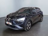 a black car parked in a room with a white wall