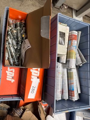 a box full of assorted items sitting on a shelf