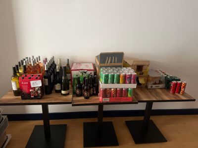 a table with a lot of bottles and cans on it