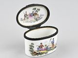 an image of a small porcelain box with a painting on it